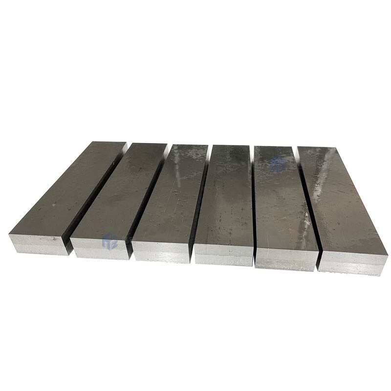 Cemented carbide tips brazed wear resistant plate.